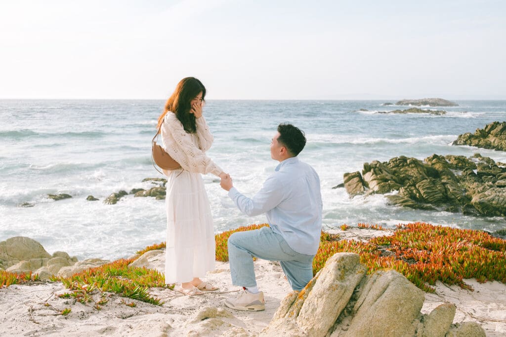Man proposing to girlfriend on 17 Mile Drive in Pebble Beach with ocean view