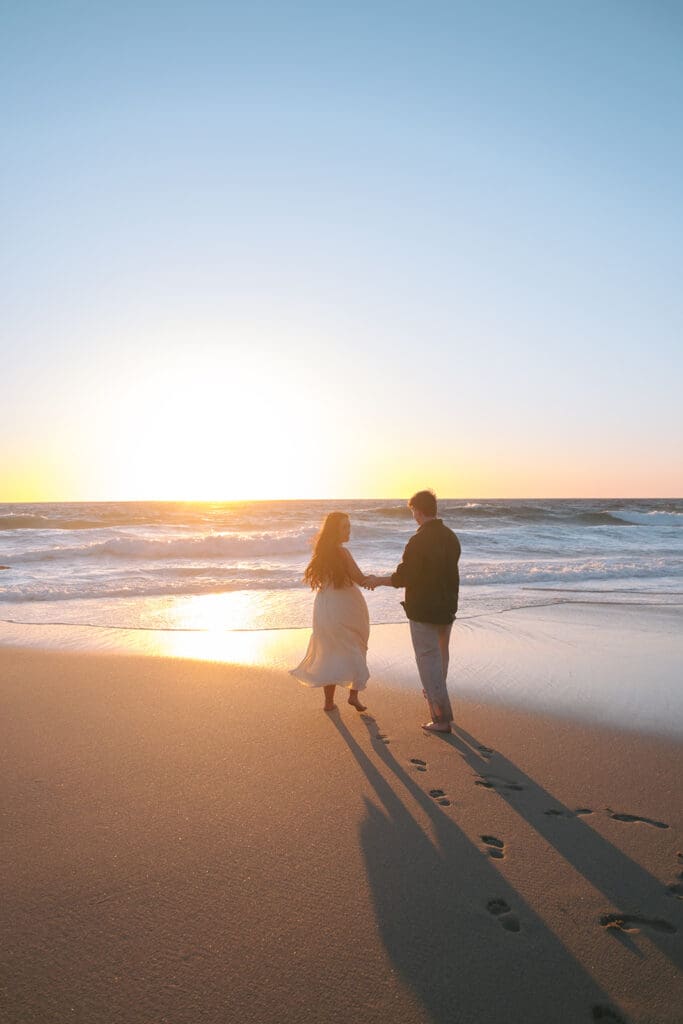 Couple at the beach in Big sur during sunset