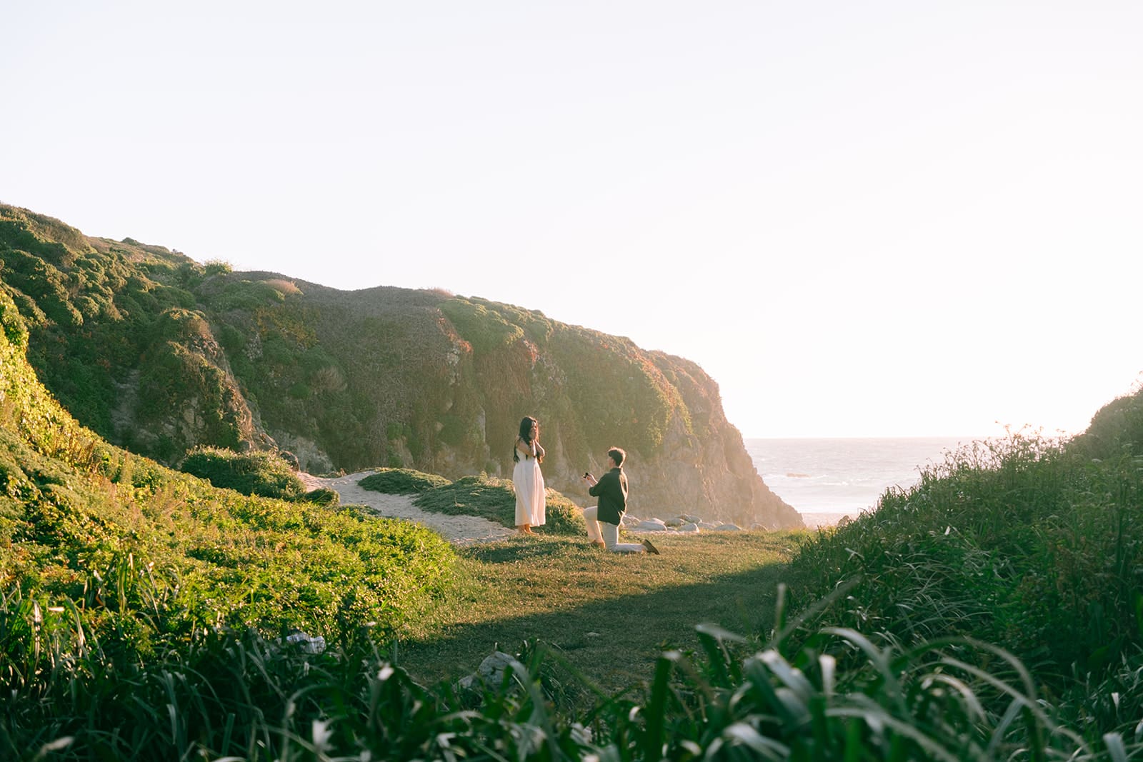 Proposing at sunset in Big Sur