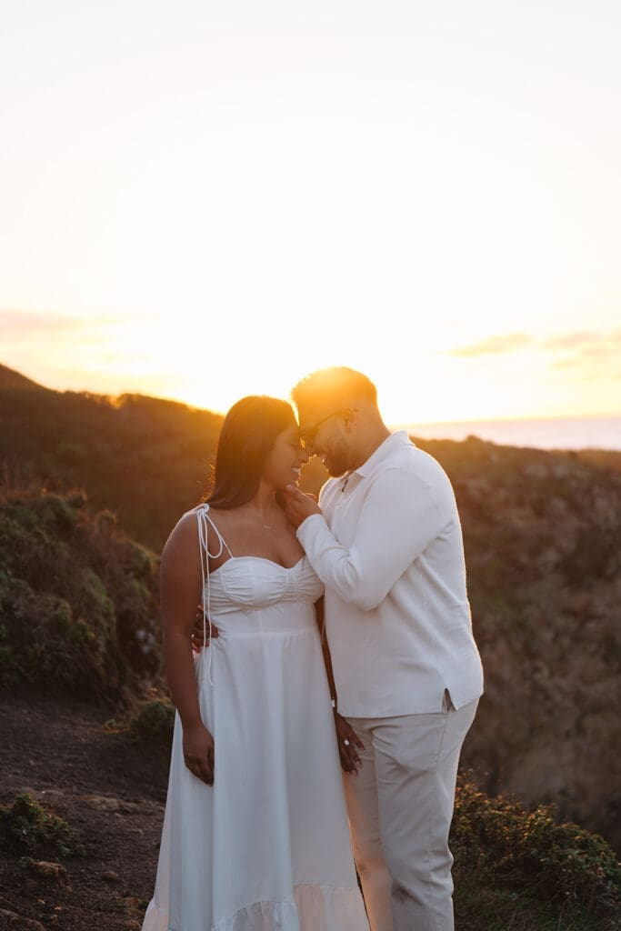 couple standing at big sur cliffs
